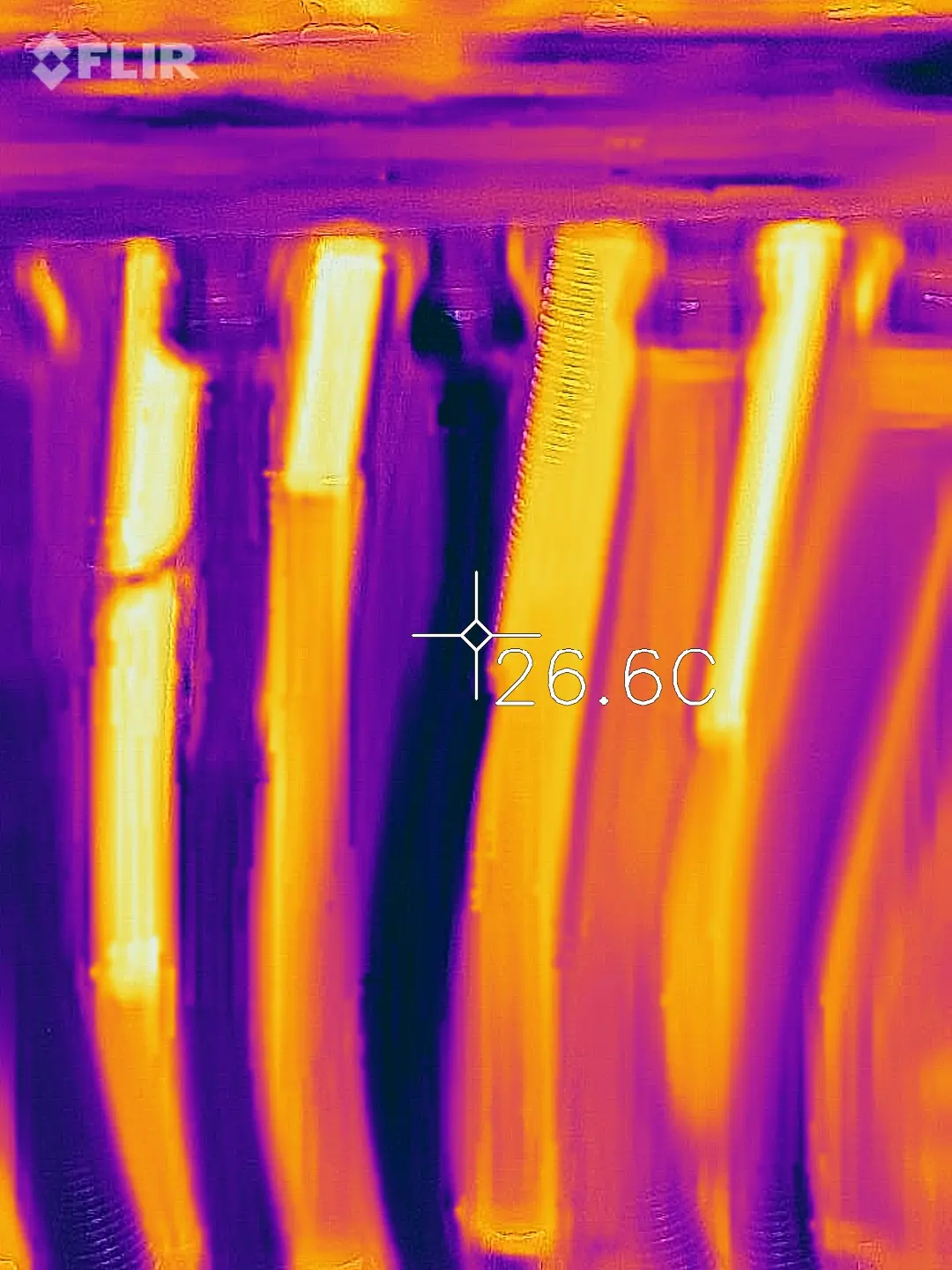 Thermal image of underfloor heating manifold pipes
